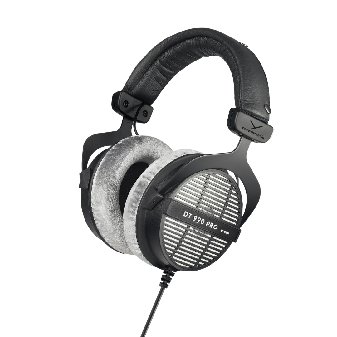 A black over-ear open dynamic headphone with coiled cable and branding 'DT 990 PRO' visible on the ear cup.