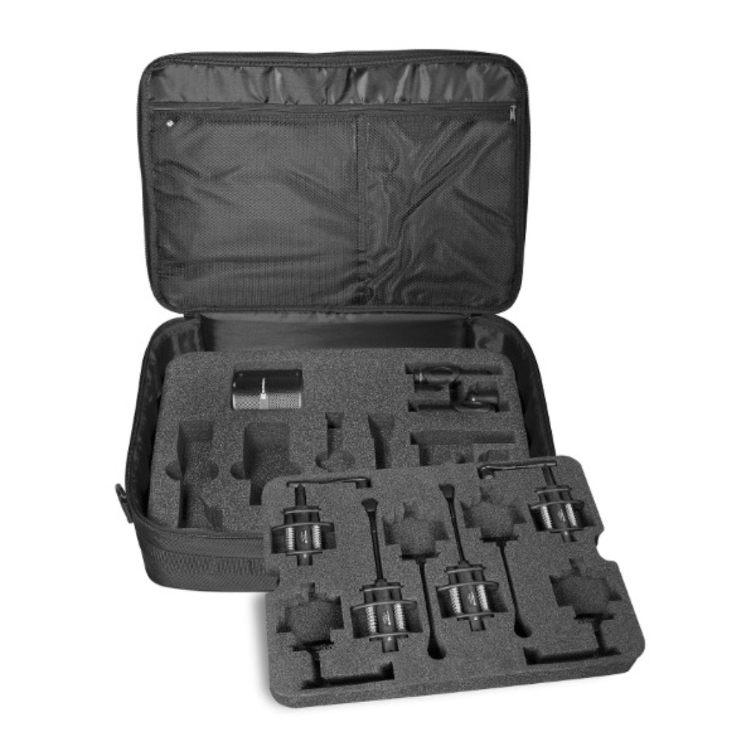 A set of microphones for drums and percussion, including various types of condenser microphones in different shapes and a boundary microphone, all laid out in a open carrying case with foam padding.